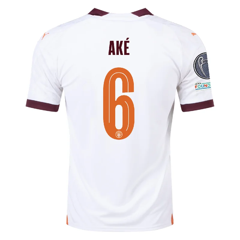 Men's Authentic Soccer Jerseys of National Teams for International Football EventsPuma Manchester City Nathan Ake Away Jersey w/ Champions League Patches 23/24 (Puma White/Aubergine)