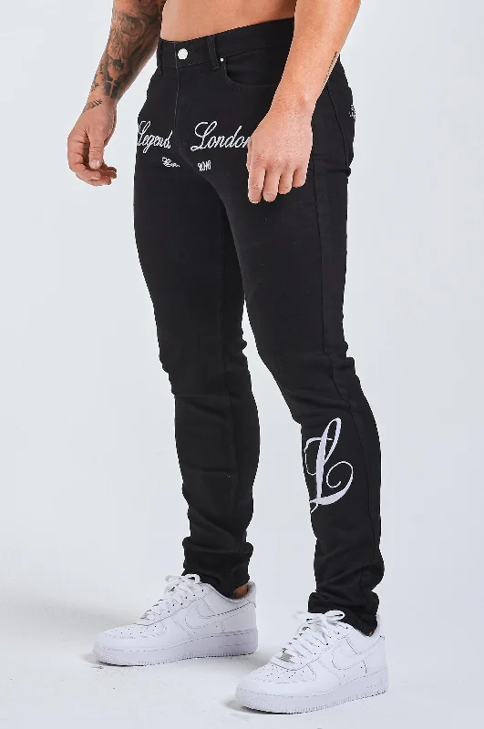 Men's Distressed Jeans with Patches for a Retro and DIY - Inspired AppearanceSLIM FIT JEANS 2.0 EMBROIDERED PRINTED DENIM - BLACK