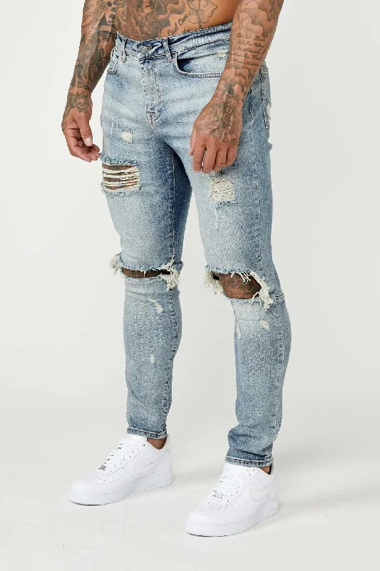 Men's Jeans with a Hidden Coin Pocket for Added ConvenienceSKINNY FIT JEANS - MID BLUE RIPPED & REPAIRED